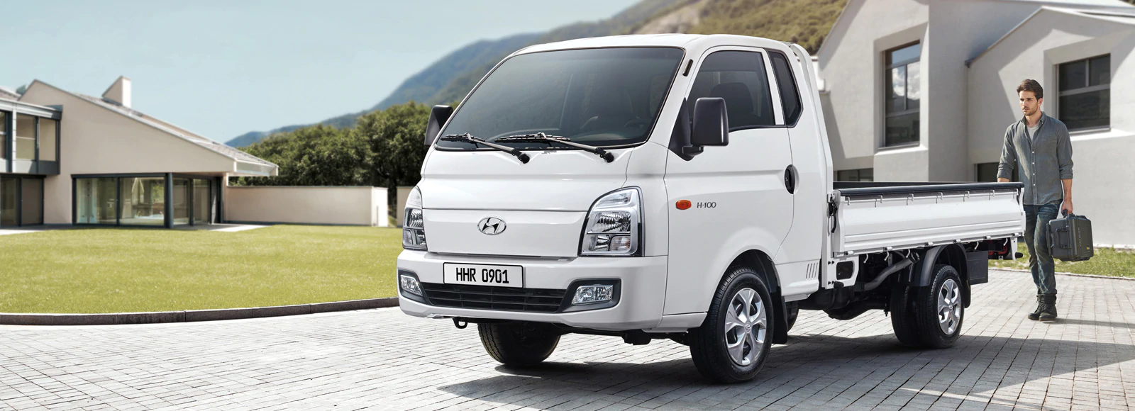 h-100-pe-2-highlights-white-car-man-outside-pc